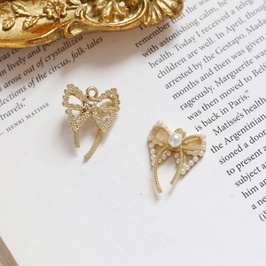 Golden bow jewelry charms with faux pearls and rhinestones for DIY earring making