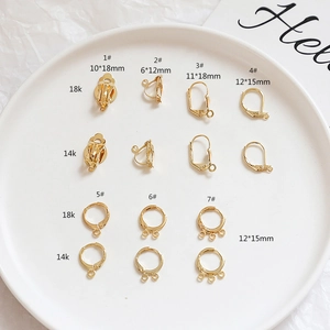 Detailed view of gold plated 14k 18k earring clips and lever backs in various sizes