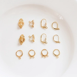 Detail of 14k gold-plated DIY jewelry findings including ear clips and hoop components