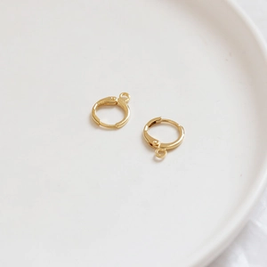 Detail of gold-plated lever back earring components with loop for DIY jewelry making