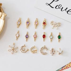 Detail of 18k gold plated charms with colorful zircon stones in vintage palace style for DIY