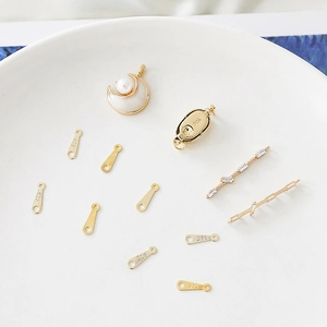 Detail of gold moon pearl pendant and 925 sterling silver jewelry connector findings