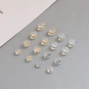 Detailed view of silicone earring backs with gold and silver plated metal accents for DIY
