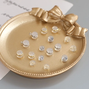 DIY jewelry earring backings in gold, silver and clear silicone on a gold plate