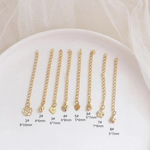 Detailed view of 8 assorted gold-plated flower, heart, and star charms for DIY jewelry