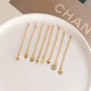 Close-up of 14k gold plated heart and star extension chains for DIY jewelry making
