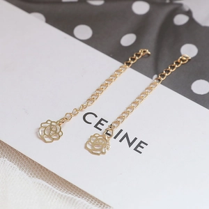 Detail of 14k gold plated rose pendant with hollow design on white card display