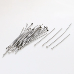 Macro detail of silver plated flat head pins for DIY jewelry making and bead stringing