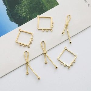 Detail of gold-plated hollow square frames and long knot pendants for DIY jewelry making