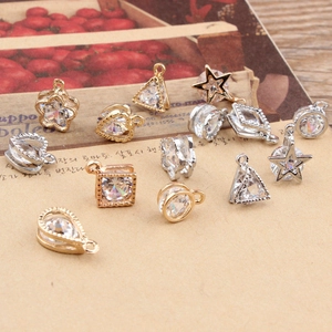 Detailed view of geometric zircon pendants in star, triangle and heart shapes for DIY jewelry