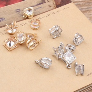 Macro shot of assorted gold and silver jewelry pendants with cubic zirconia for DIY jewelry