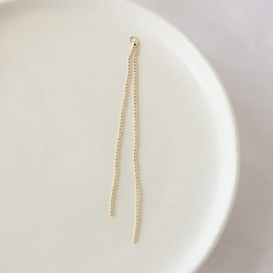 Detail of gold-plated double ball chain tassel pendant with ring for DIY jewelry making