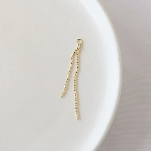 Detail of gold-plated double bead chain tassel charms with closed ring for DIY jewelry making