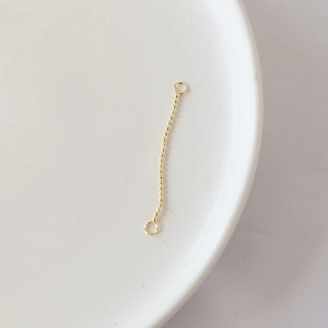 Detailed view of gold-plated bead tassel chain connector with double rings for DIY jewelry