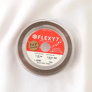 Macro detail of 0.40mm brown nylon coated 7-strand stainless steel jewelry wire
