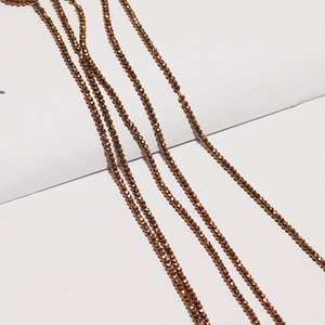 Faceted bronze crystal glass beads showing reflective metallic surface for DIY jewelry making