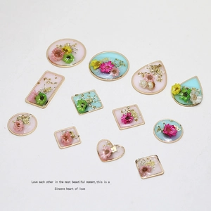 Assorted geometric resin dried flower pendants with gold alloy frames for DIY jewelry