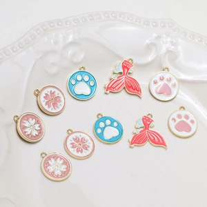 DIY alloy charms with floral, paw, and mermaid tail designs for handmade jewelry