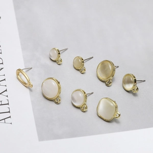DIY jewelry parts featuring cat eye stone studs with gold bases in various shapes