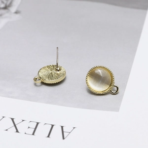 Detailed view of S925 silver gold-plated stud earrings with cat's eye stone and DIY loop