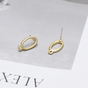 Detailed view of matte gold oval stud earring findings with loops for DIY jewelry making