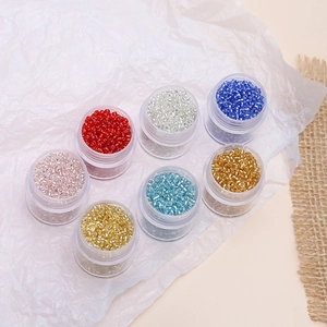 Macro shot of 2mm silver-lined seed beads in seven colors for DIY jewelry making