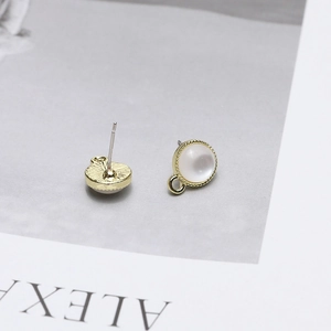 Detailed view of gold plated round stud earrings with white cat eye stone and DIY loop