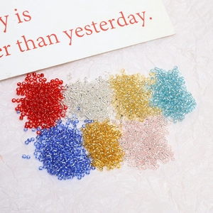 Mix of 2mm silver-lined colorful seed beads for DIY jewelry making on white background