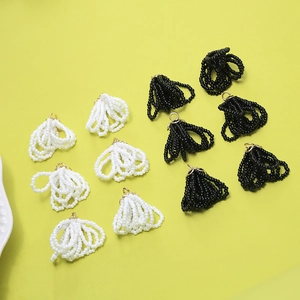 Macro shot of handmade beaded ring tassels with gold rings for DIY earring making