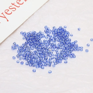 Macro shot of 2mm blue silver-lined glass seed beads for DIY jewelry making