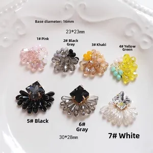 Detail of colorful crystal bead floral pendants and fan-shaped charms for DIY jewelry making