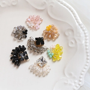 Detailed view of handmade beaded crystal charms for DIY jewelry making and earrings