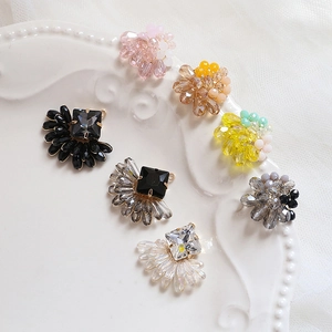 DIY colorful crystal bead jewelry charms with copper wire wrap on white tray