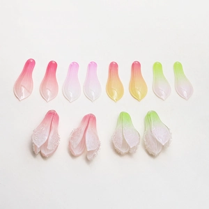 Macro detail of gradient resin magnolia petals and buds for DIY jewelry crafting