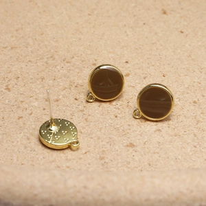 Detail of round gold and brown enamel stud earrings with closed loop for DIY jewelry
