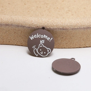 Detailed front and back view of brown alloy bear charms with Welcome and Hi text