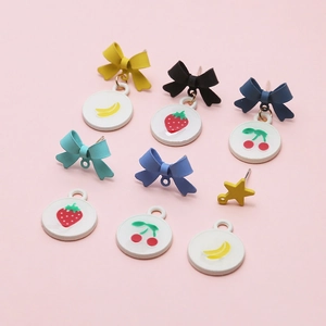 Colorful DIY earring set with bow studs and fruit pendants in pastel macaron shades