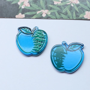 Blue acrylic apple charm for DIY crafts featuring a minimalist hand-drawn design