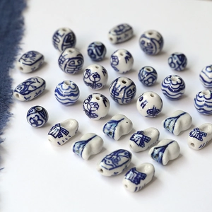 Macro shot of blue and white porcelain beads with traditional Chinese patterns for jewelry diy