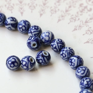 Macro shot of blue and white porcelain round beads for DIY jewelry and handmade crafts
