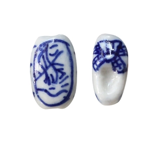 Handcrafted blue and white porcelain beads with traditional Chinese floral patterns