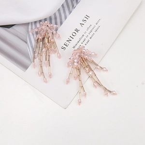 Macro detail of a pink crystal beaded tassel pendant for DIY jewelry accessories