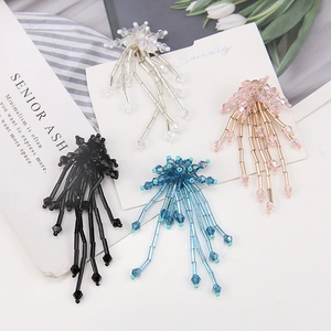 Handmade crystal bead flower pendants in white, pink, black, and blue colors
