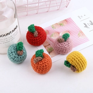 Handmade crochet apple pendants in colorful yarn for DIY jewelry and bag accessories