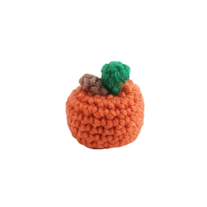 Handmade crochet orange pumpkin charm with green leaf for DIY crafts and accessories