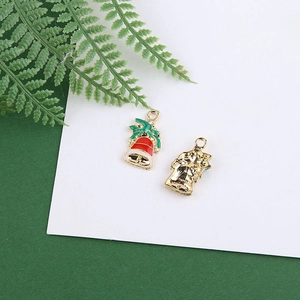 Detailed front and back view of red and green Christmas bell pendant with gold finish
