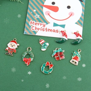 DIY Christmas charms collection with Santa and wreath on festive green background