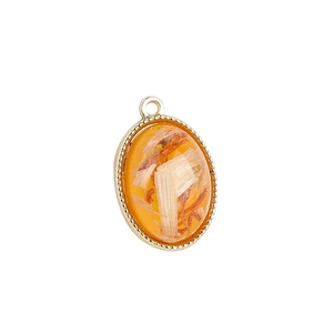 Oval DIY jewelry pendant with amber resin, natural petal inlay and gold beaded frame