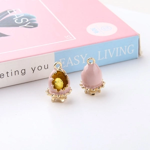 Detail of DIY chicken in shell alloy pendant with pink enamel finish and golden ring