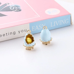 Detail of light blue enamel eggshell and yellow chick DIY alloy jewelry pendants
